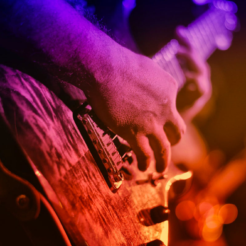 Live musician playing guitar