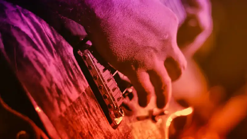 Live musician playing guitar