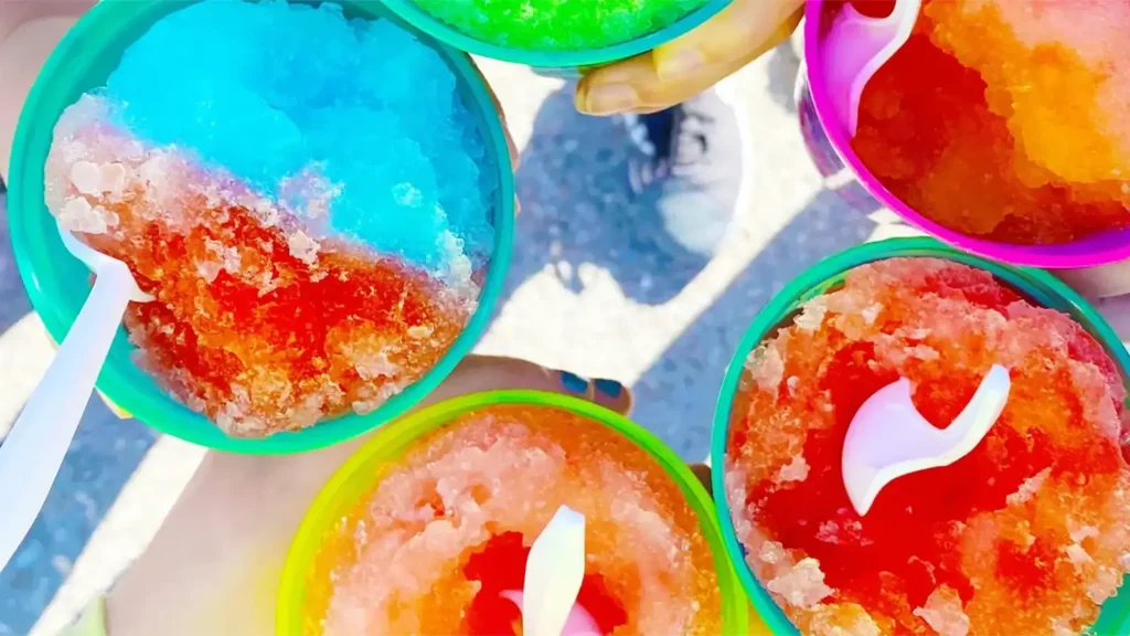 Colorful Sno-Cones in cups with spoons