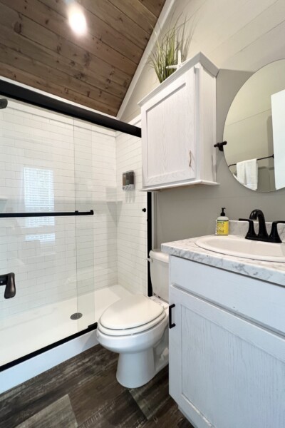 Welcome to Coastal Cottage, where coastal vibes meet peace and tranquility. This cabin offers a serene escape with its cozy queen bed in the master bedroom and a unique queen/twin loft perfect for families. Enjoy outdoor grilling with the gas grill and gather around the firepit for cozy evenings under the stars. Whether you're here to relax or seek adventure, Coastal Cottage provides the perfect home base. Features: 1 queen bed, 1 queen/twin loft, Firepit, Grill, Sleeps 6