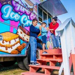 Mom giving her kids ice cream cones at Fire & Ice Cream Truck