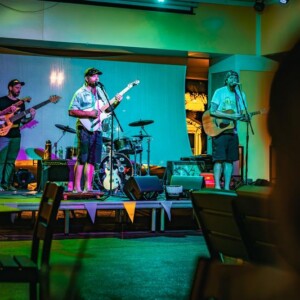 Live band performing and singing in the Island Oaks clubhouse
