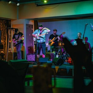 Live band entertaining a crowd at the Island Oaks clubhouse