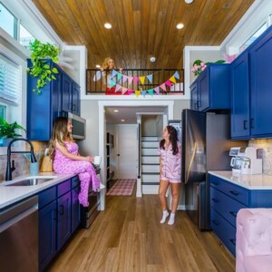 Women in an Island Oaks tiny cabin decorating for a party