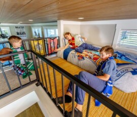 Kids on the upper loft of an Island Oaks cabin