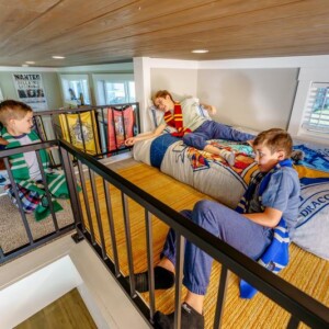 Kids on the upper loft of an Island Oaks cabin